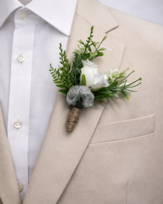 emerald green tie with white rose boutonniere on beige suit groom wedding accessory set”