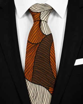 Kunle men’s Ankara tie in burnt orange, brown, cream and black geometric print