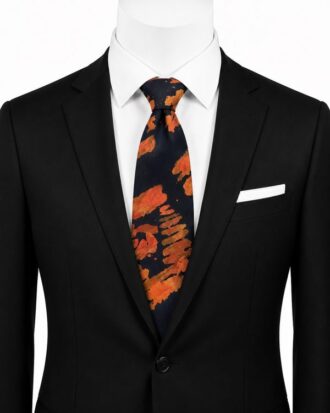 Oluwadamilare navy and orange Ankara print tie styled with a black suit