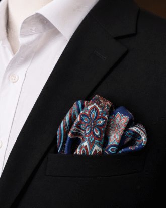 Rotimi Navy Paisley Pocket Square styled in the breast pocket of a black suit